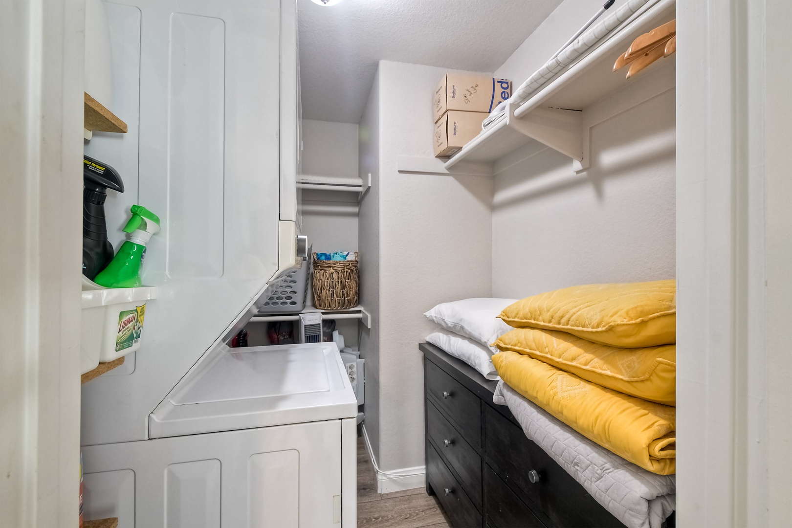 Private laundry facilites are tucked away in the bedroom closet