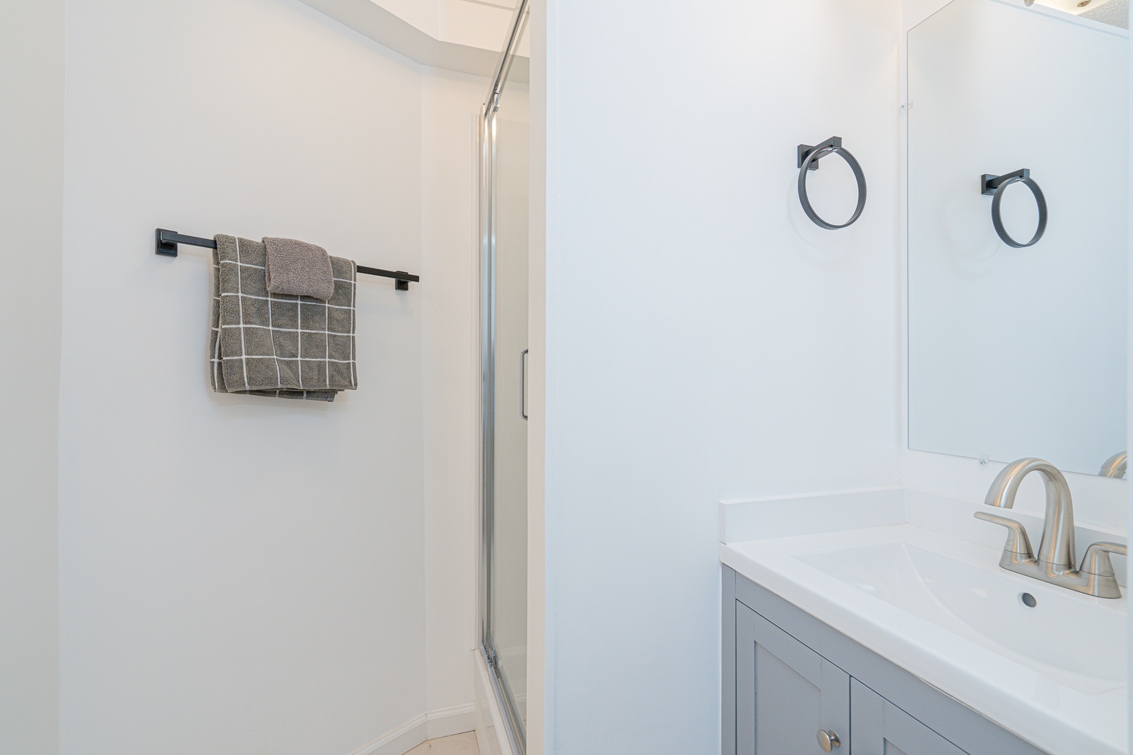 The king ensuite features a single vanity & glass shower