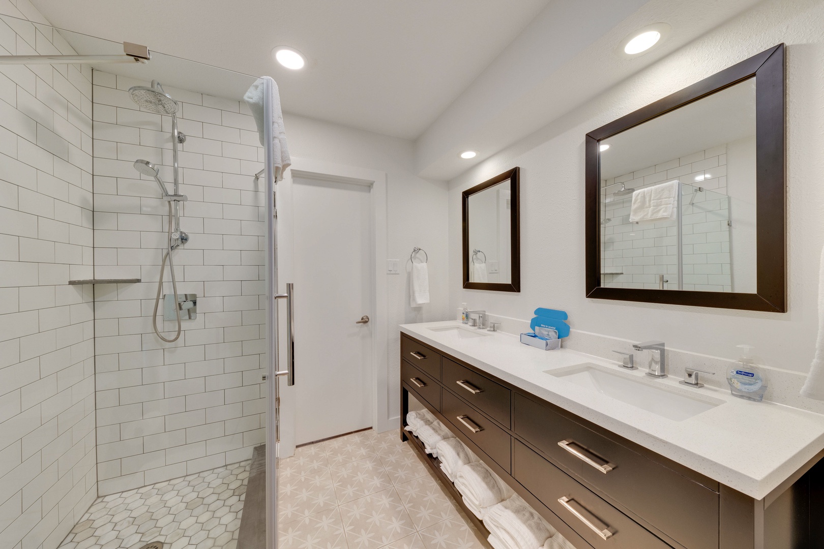 The pass-through bath off the master suite offers a double vanity & shower
