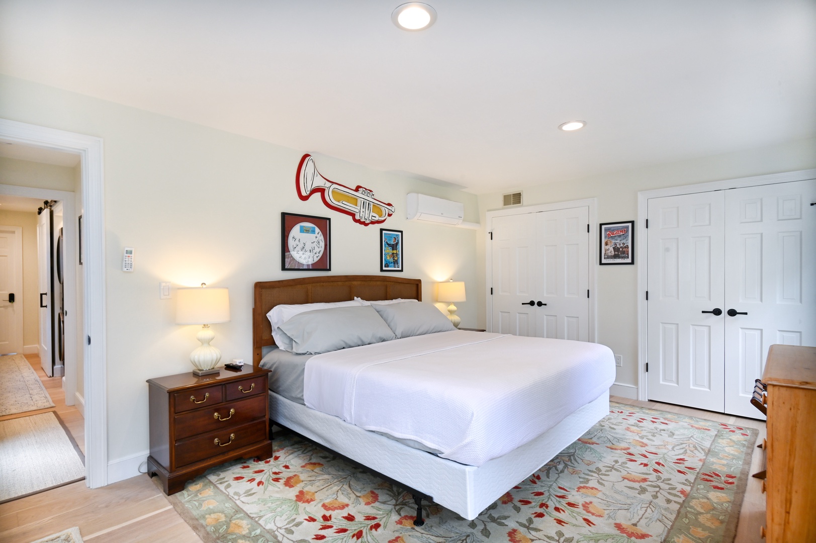 Playhouse’s chic king bedroom features a Smart TV & fantastic theater artwork