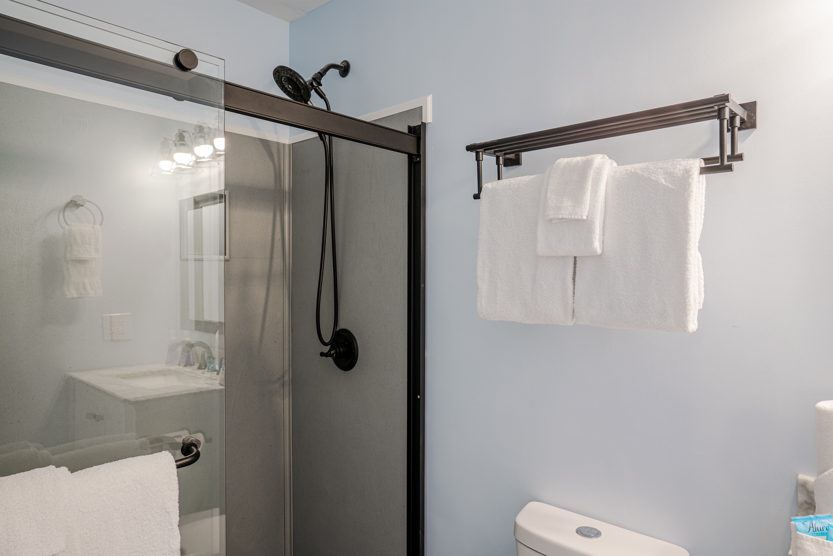 The second bedroom ensuite contains a single vanity & glass shower