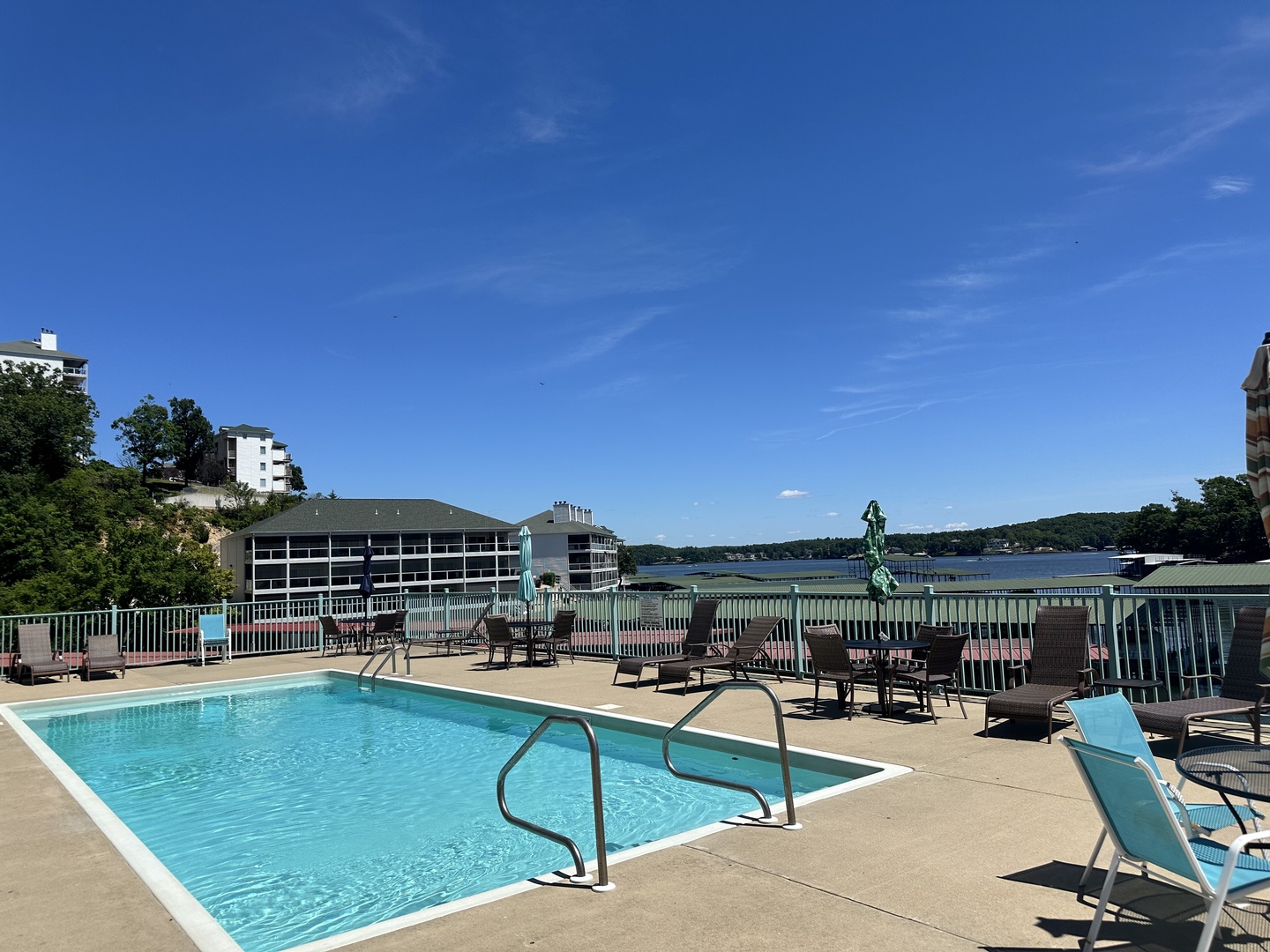 Dive into the pool with a front-row view of the serene lake