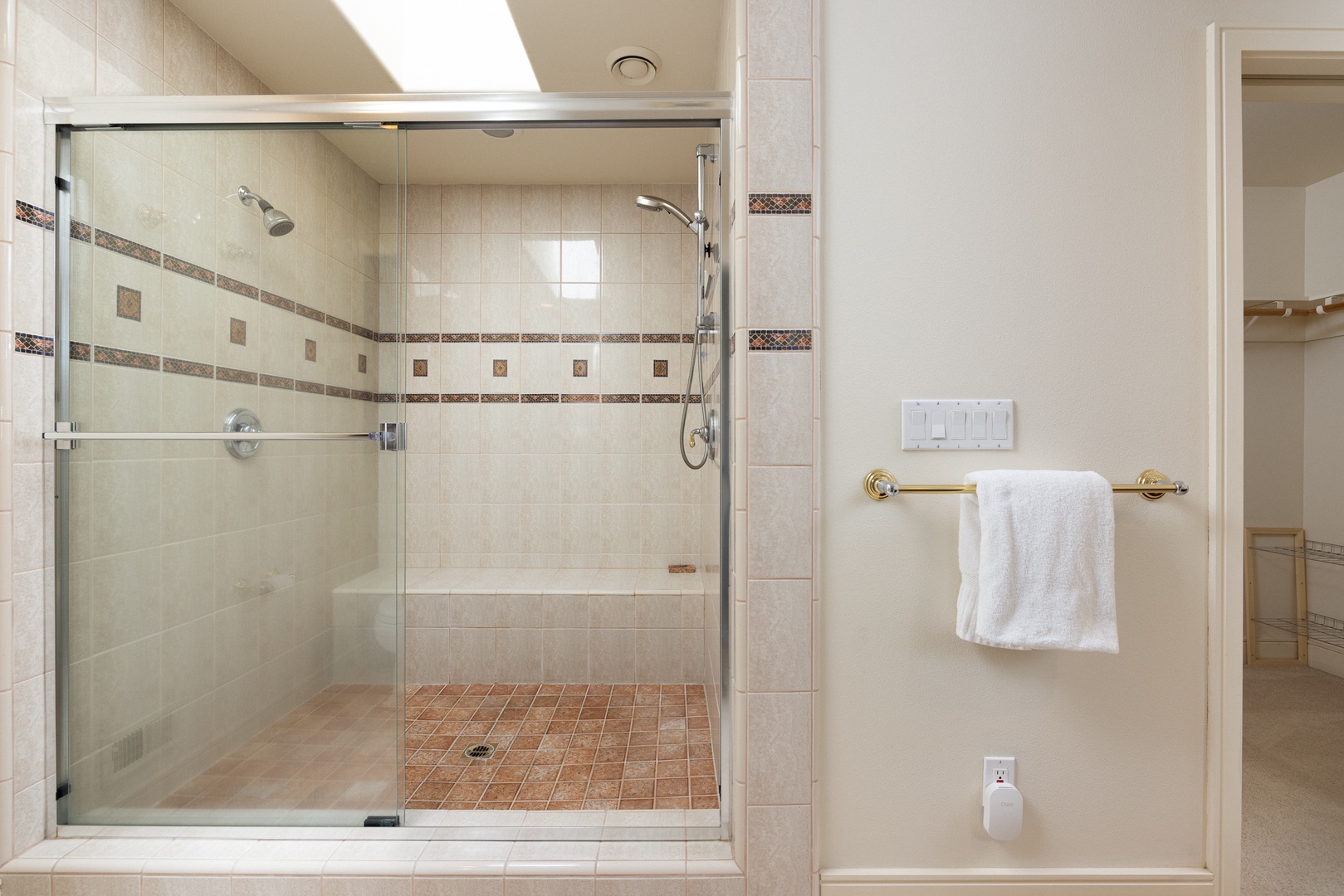 A large double vanity, shower, & walk-in closet await in the king ensuite