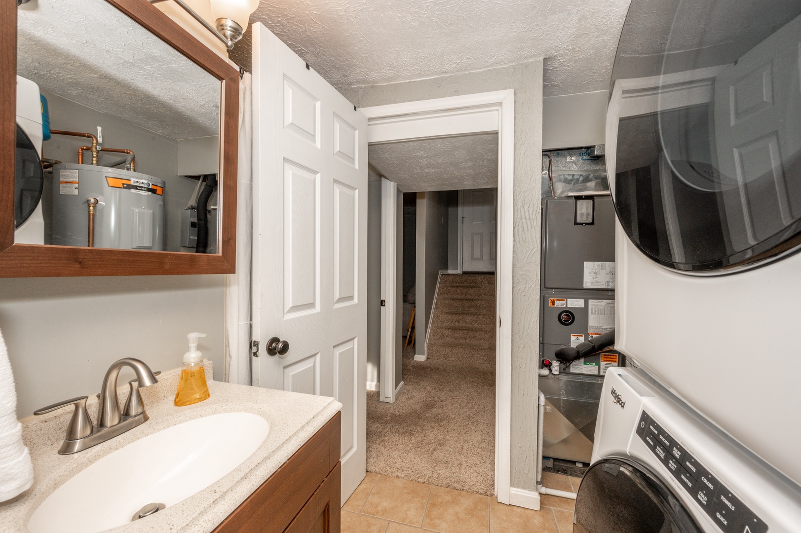 The lower-level bathroom includes a shower & private laundry