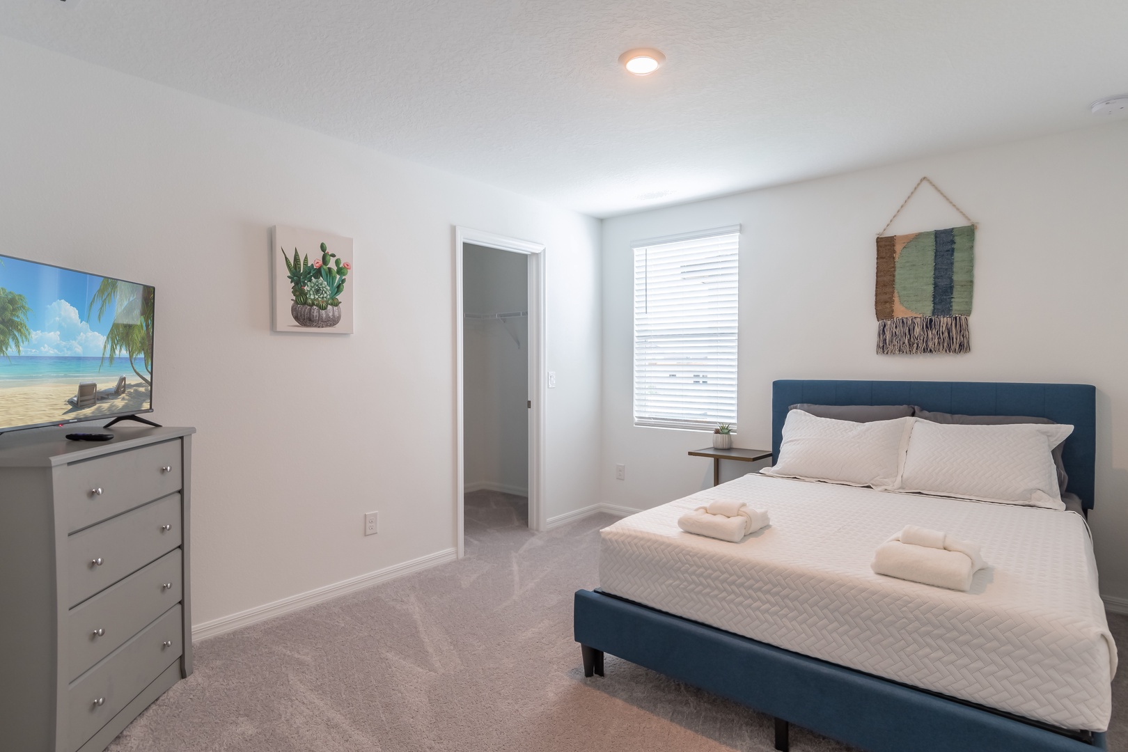 This serene 2nd floor bedroom offers a queen bed & Smart TV