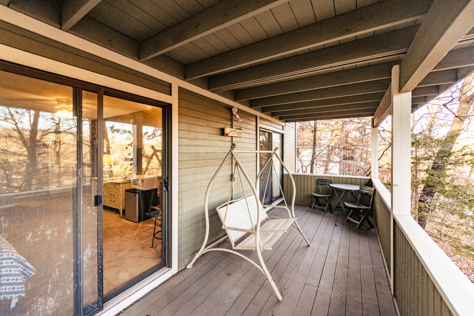 Relax & sway as you take in the view on the lower-level back deck