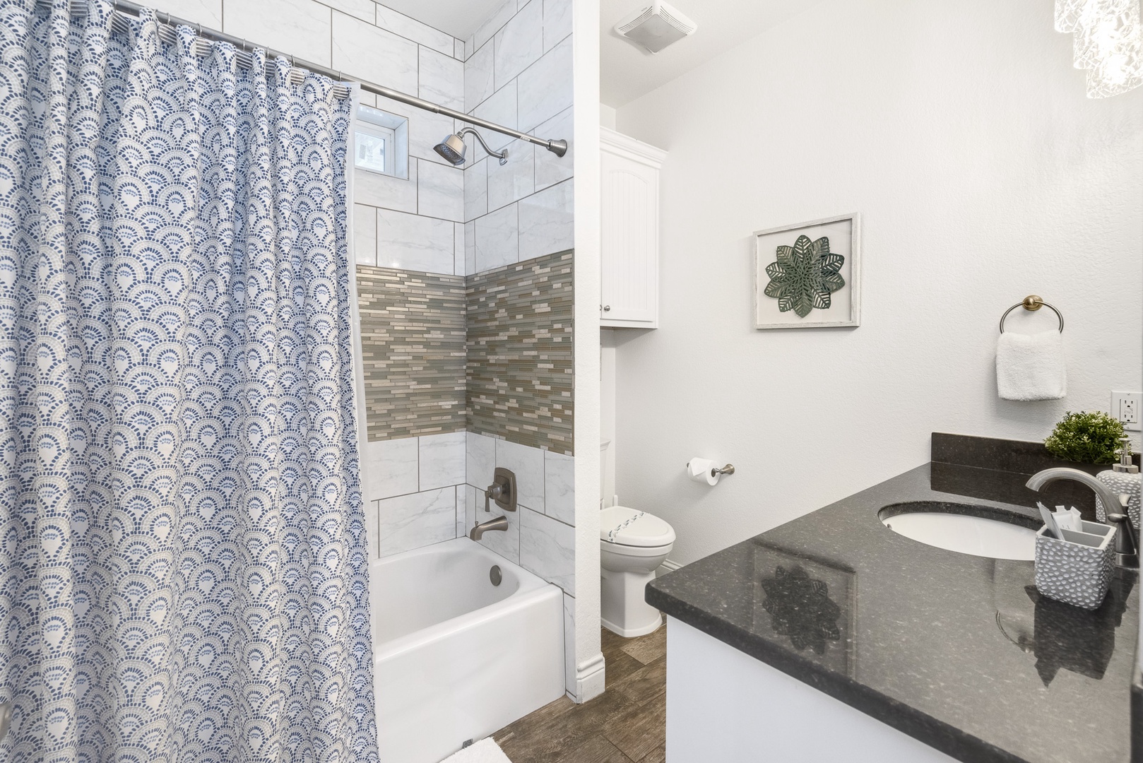 The 2nd Floor Shared Bathroom offers an oversized Single Vanity and tile Shower/Tub Combo