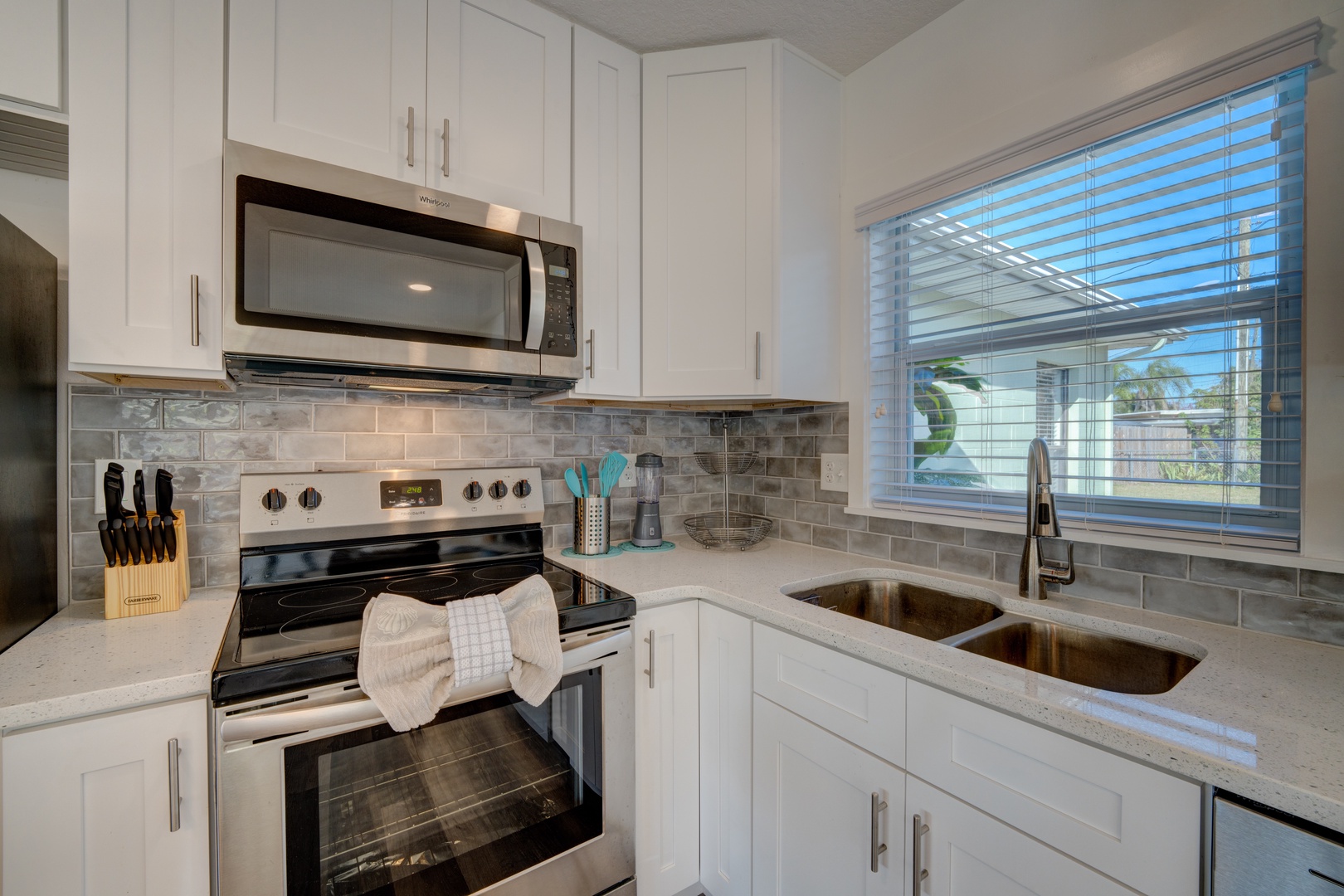 The open, airy kitchen offers ample space & all the comforts of home