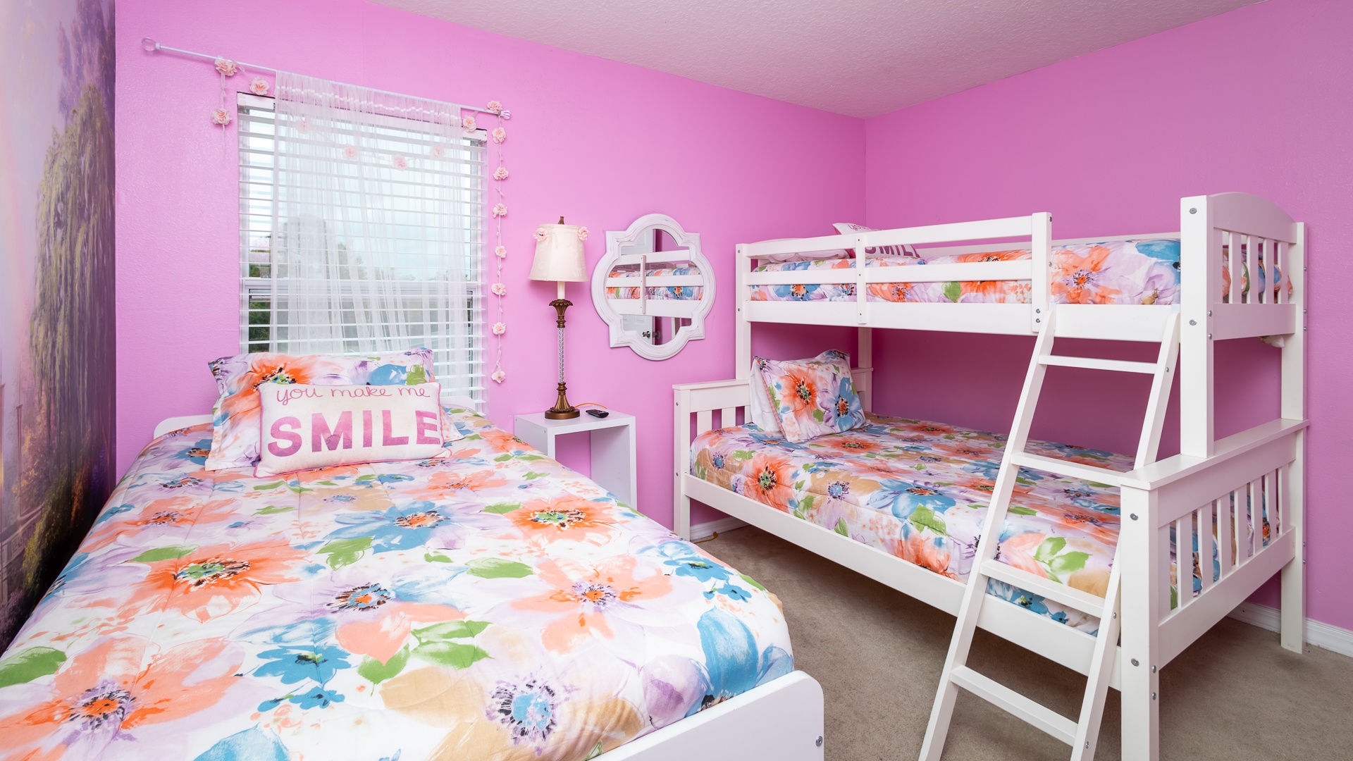 This 2nd floor princess-themed bedroom has a twin-over-full bunk bed & an additional twin bed