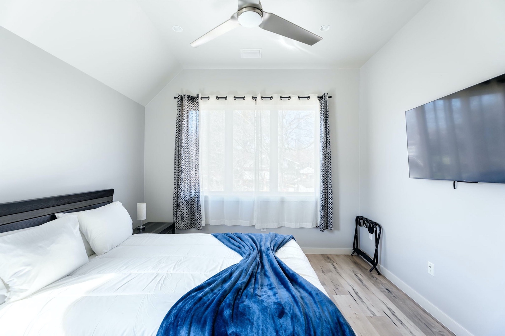 The final bedroom sanctuary includes a plush queen-sized bed & Smart TV