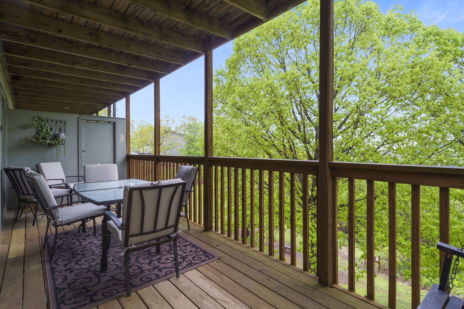 Panoramic view from the covered deck with swing, and outdoor seating
