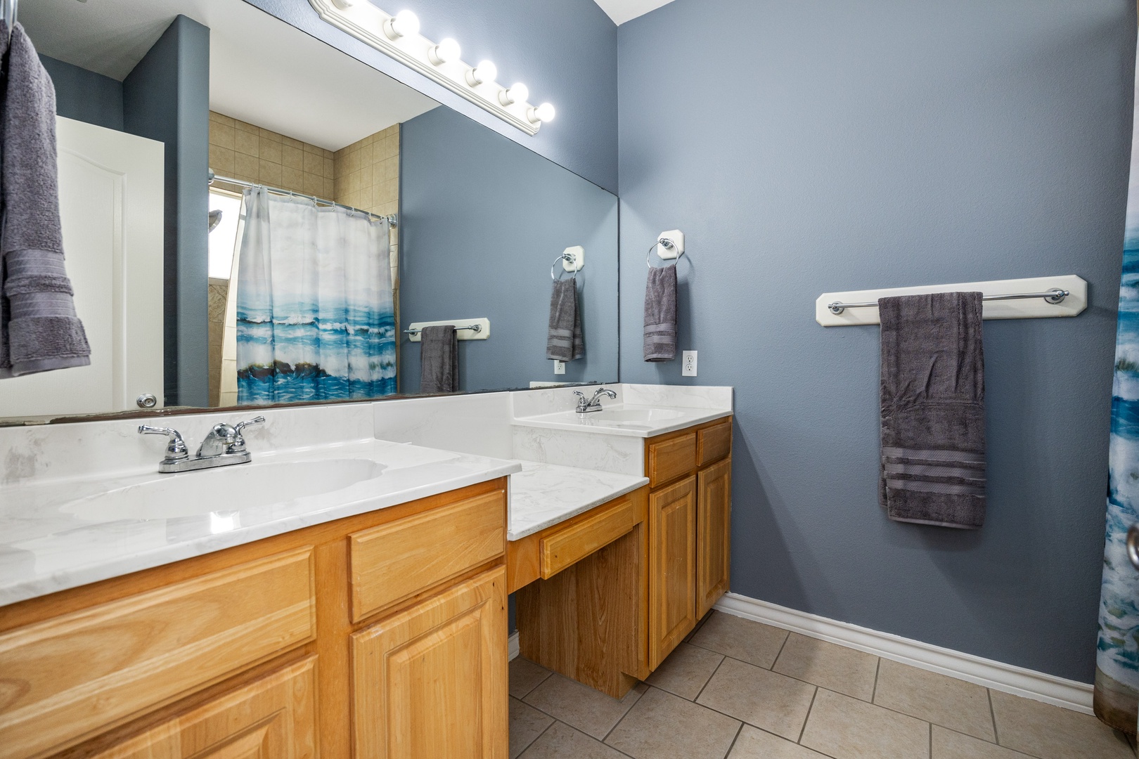 This private ensuite hosts a double vanity & walk-in shower