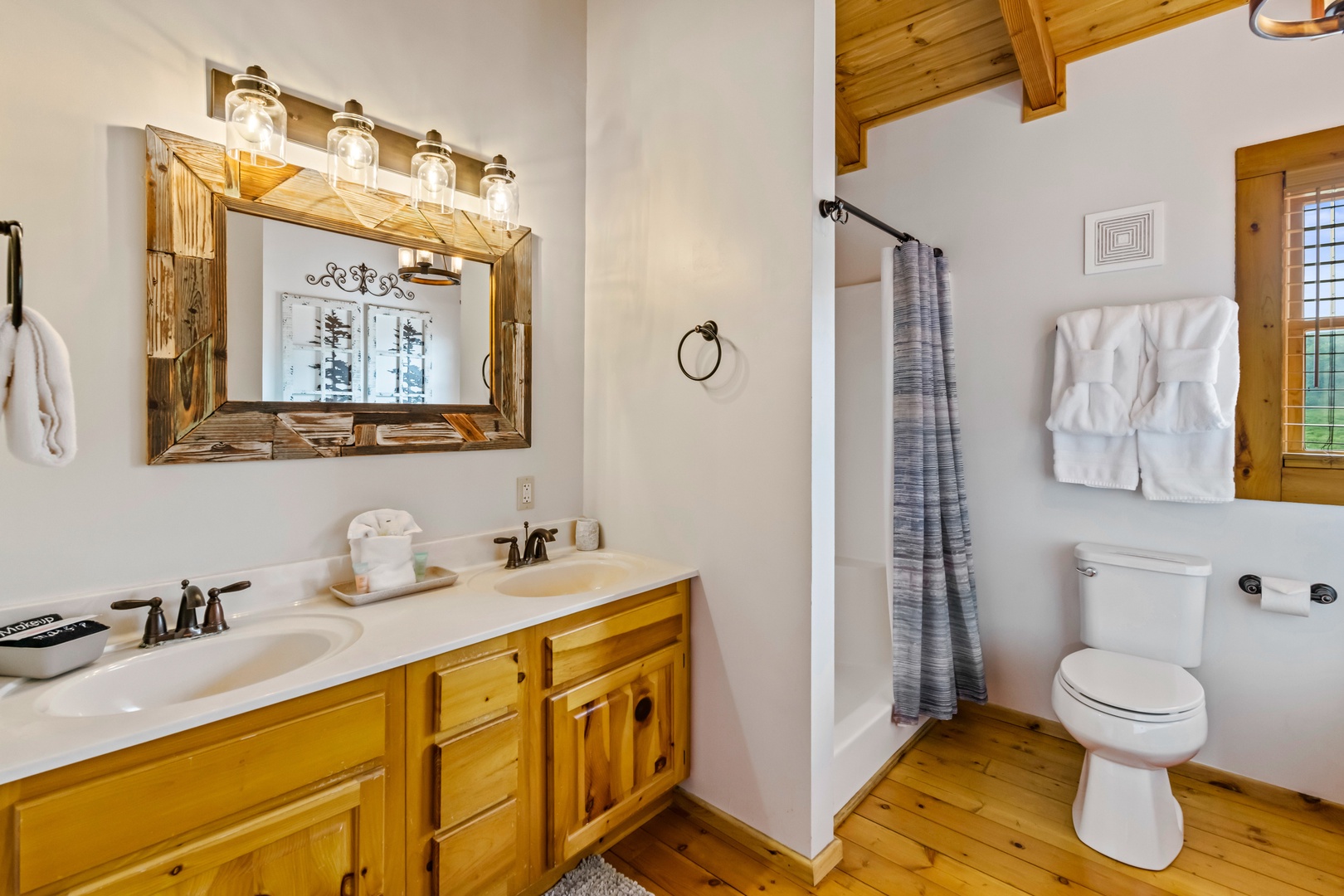 A double vanity, shower, & Jacuzzi tub await in the 2nd-floor full bath