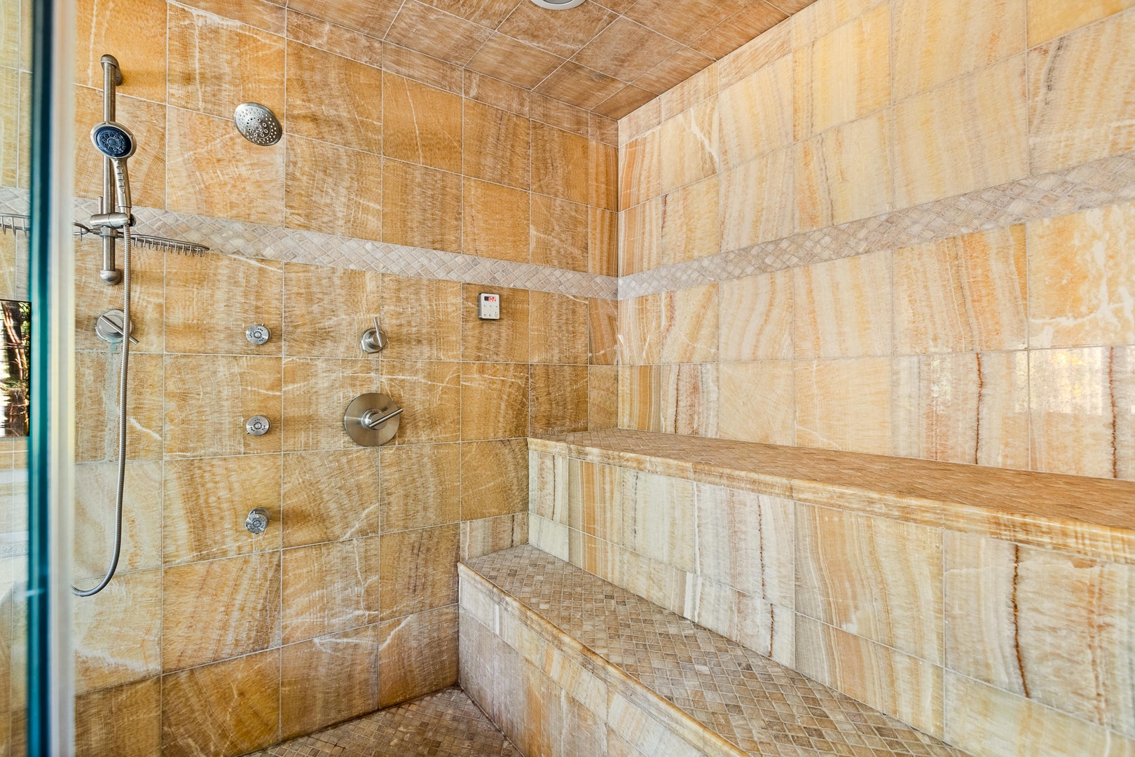 Bedroom 2 en-suite with dual sinks, soaking tub, and large walk in shower.