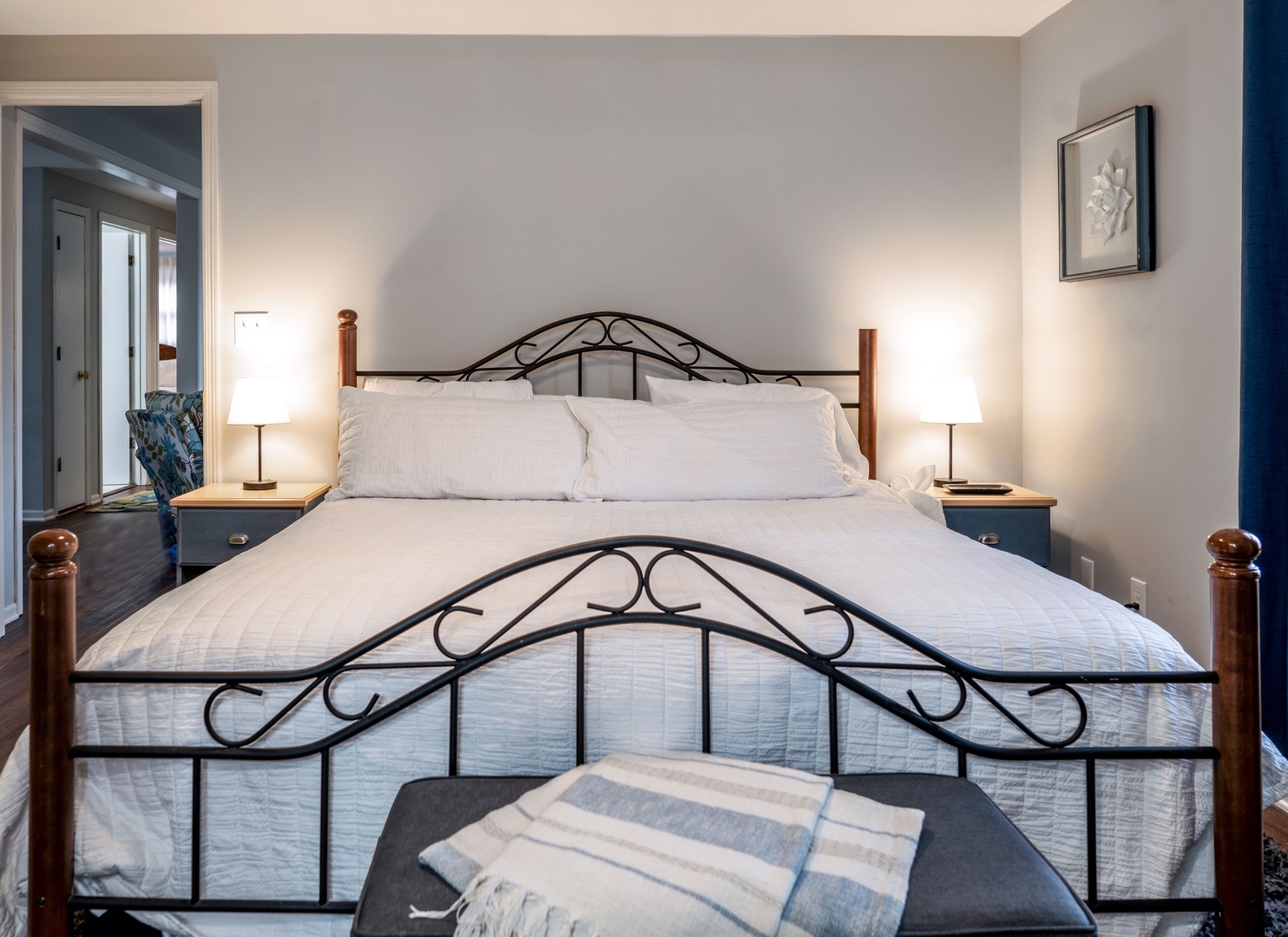 The main-level master bedroom offers a king bed & private ensuite