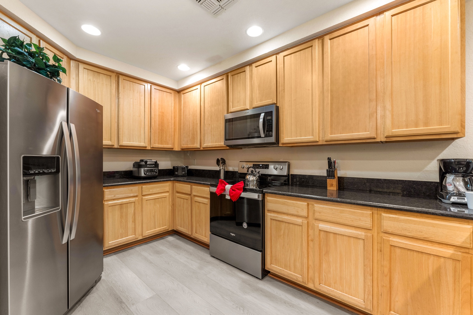 The open, airy kitchen offers ample space & all the comforts of home