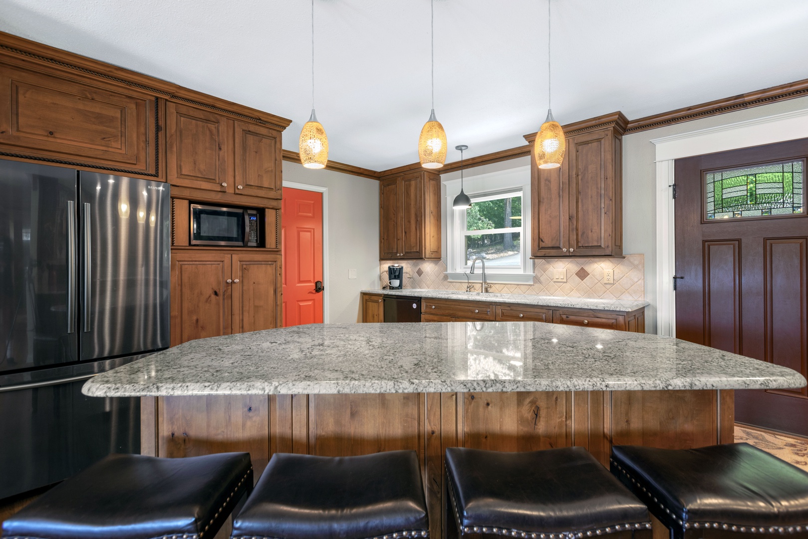 The main house’s chic kitchen offers ample space for the whole crew