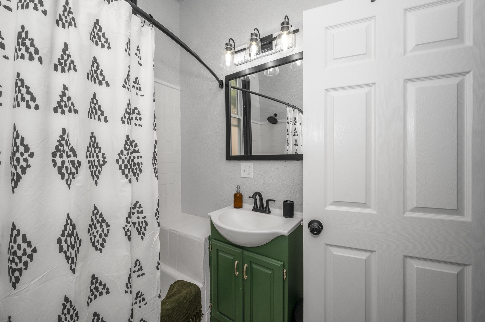 Get ready in this full bath, offering a single vanity & shower/tub combo