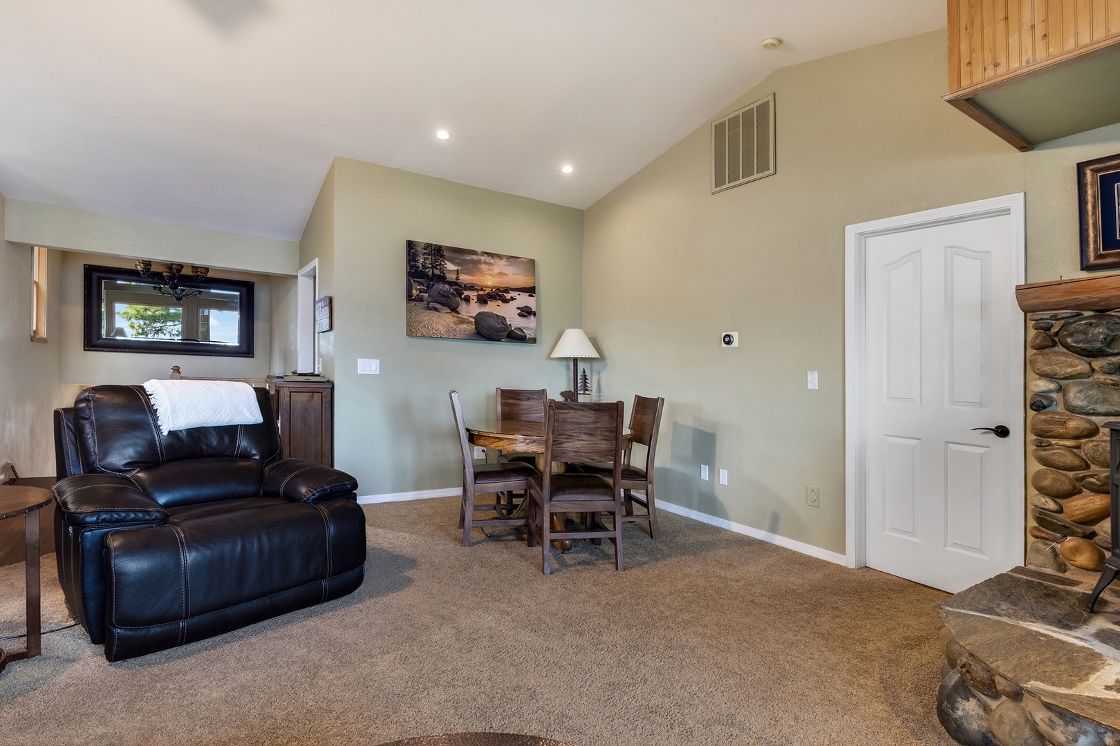 Lower living area with sofa sleeper, Smart TV, and deck