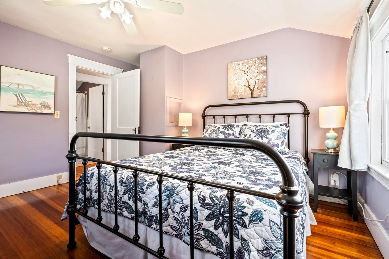 The 2nd floor queen bedroom showcases a cozy bed