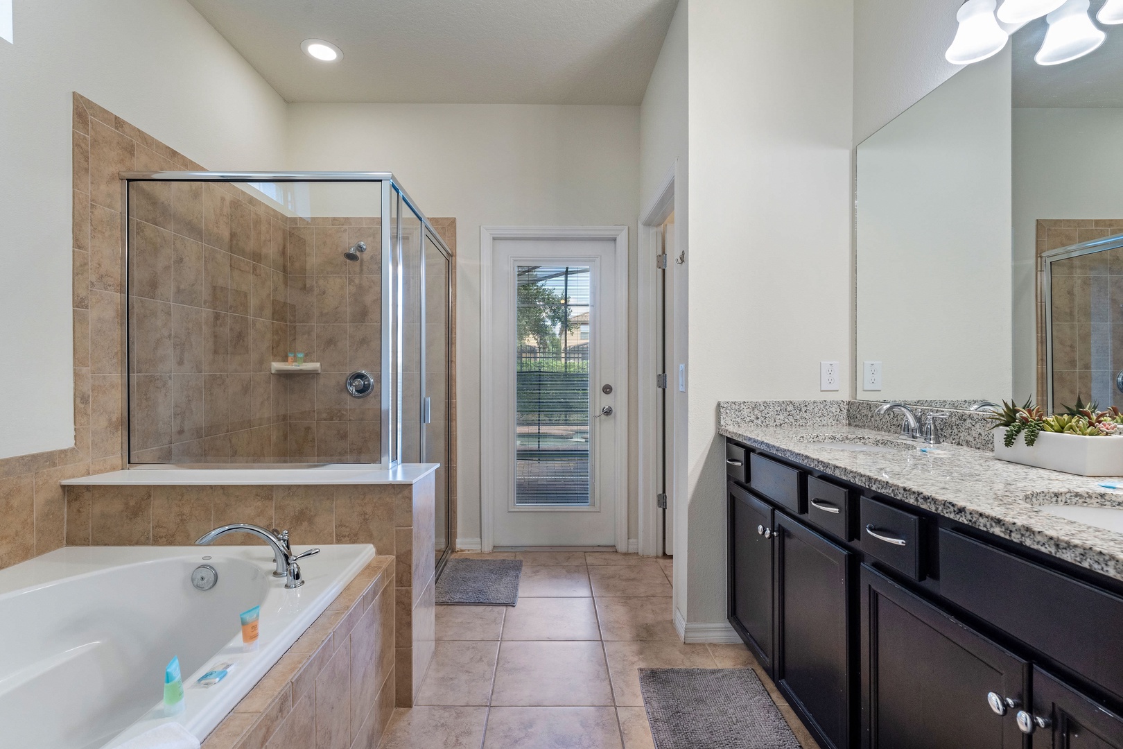 Ensuite bathroom with separate shower and soaking tub