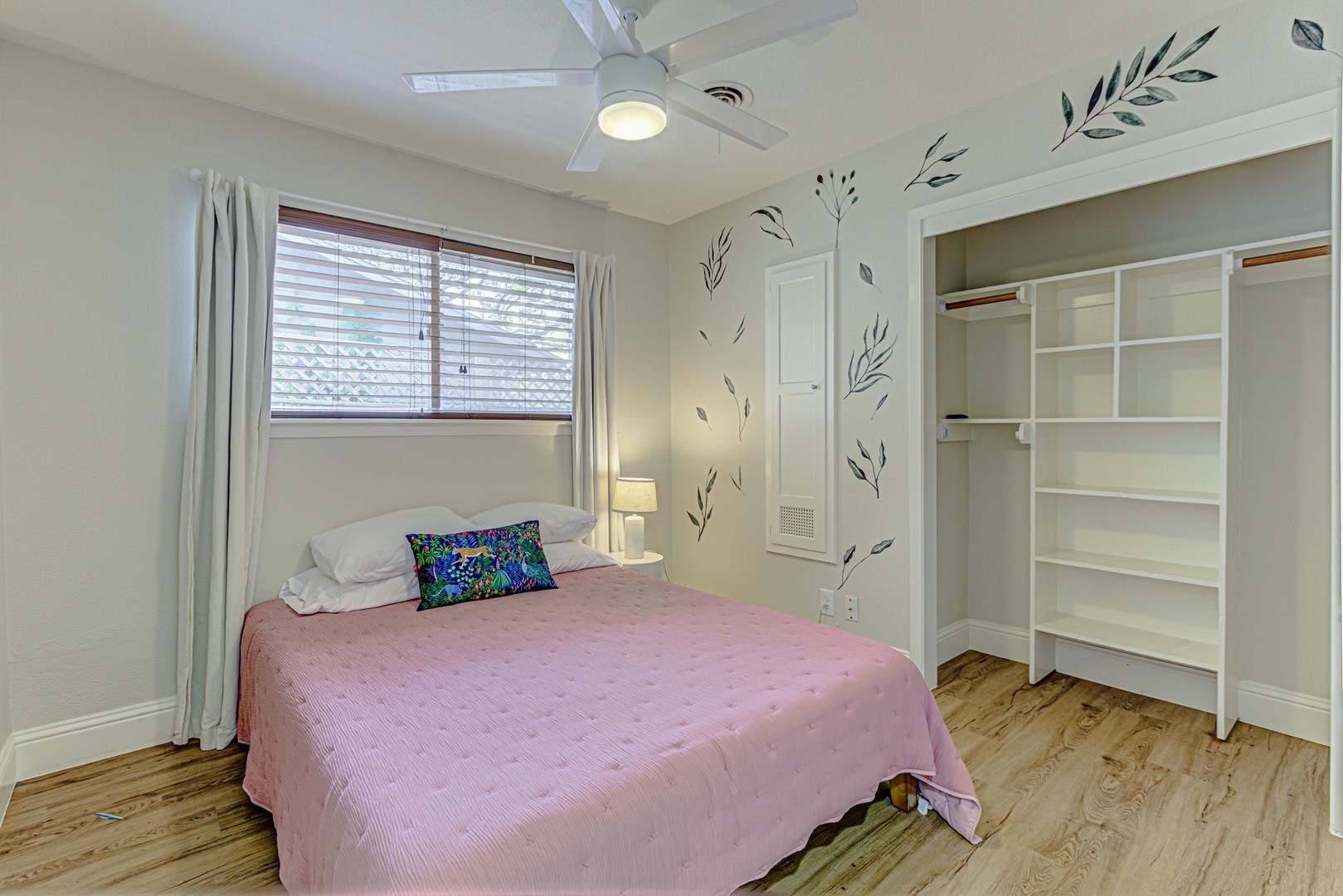 The second bedroom sanctuary features a plush queen-sized bed