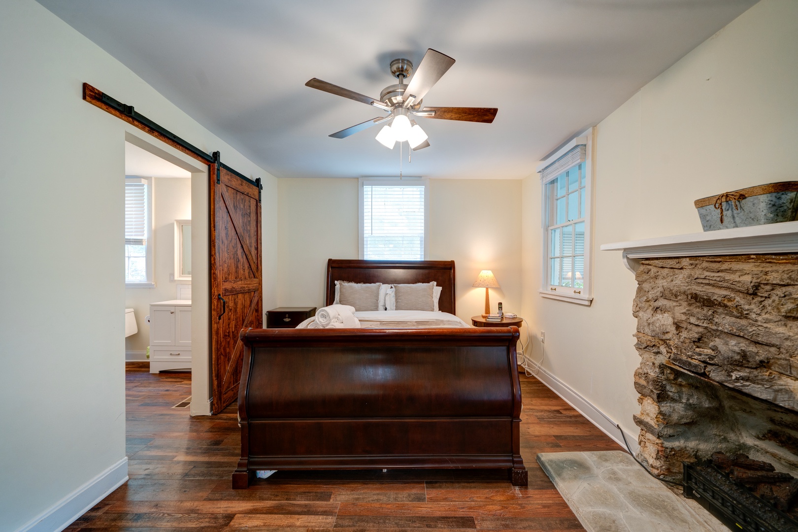 The master suite boasts a queen bed, ensuite bath with laundry, & porch access