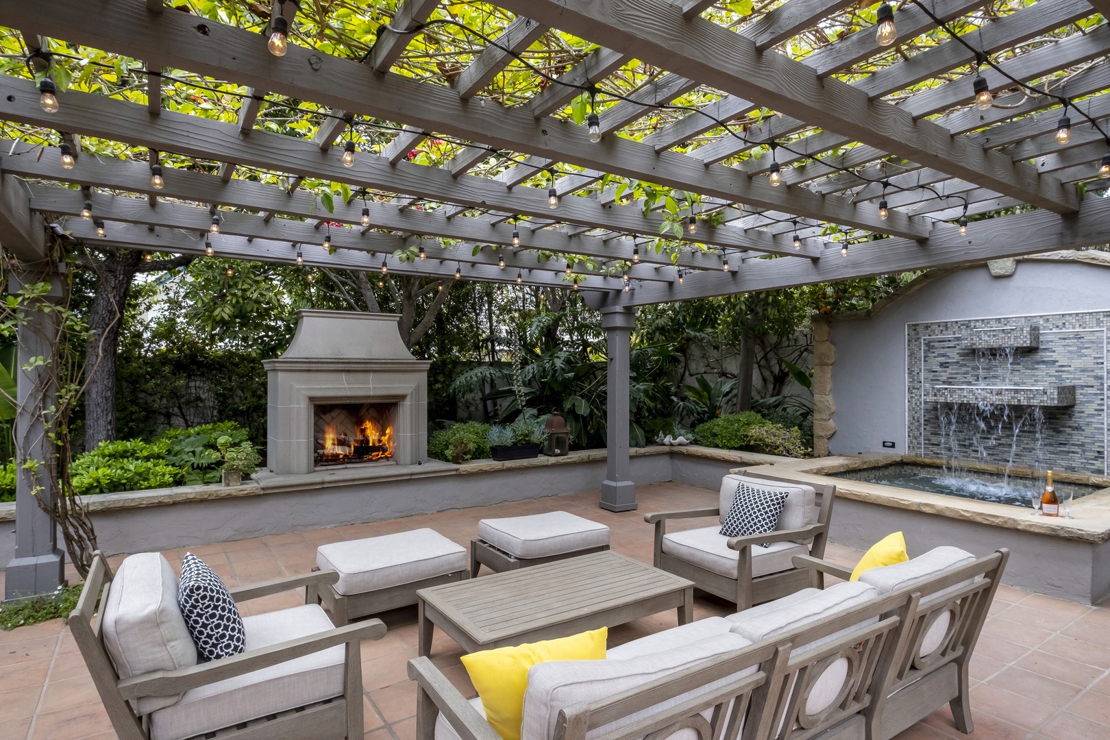 Backyard with seating by the outdoor fireplace