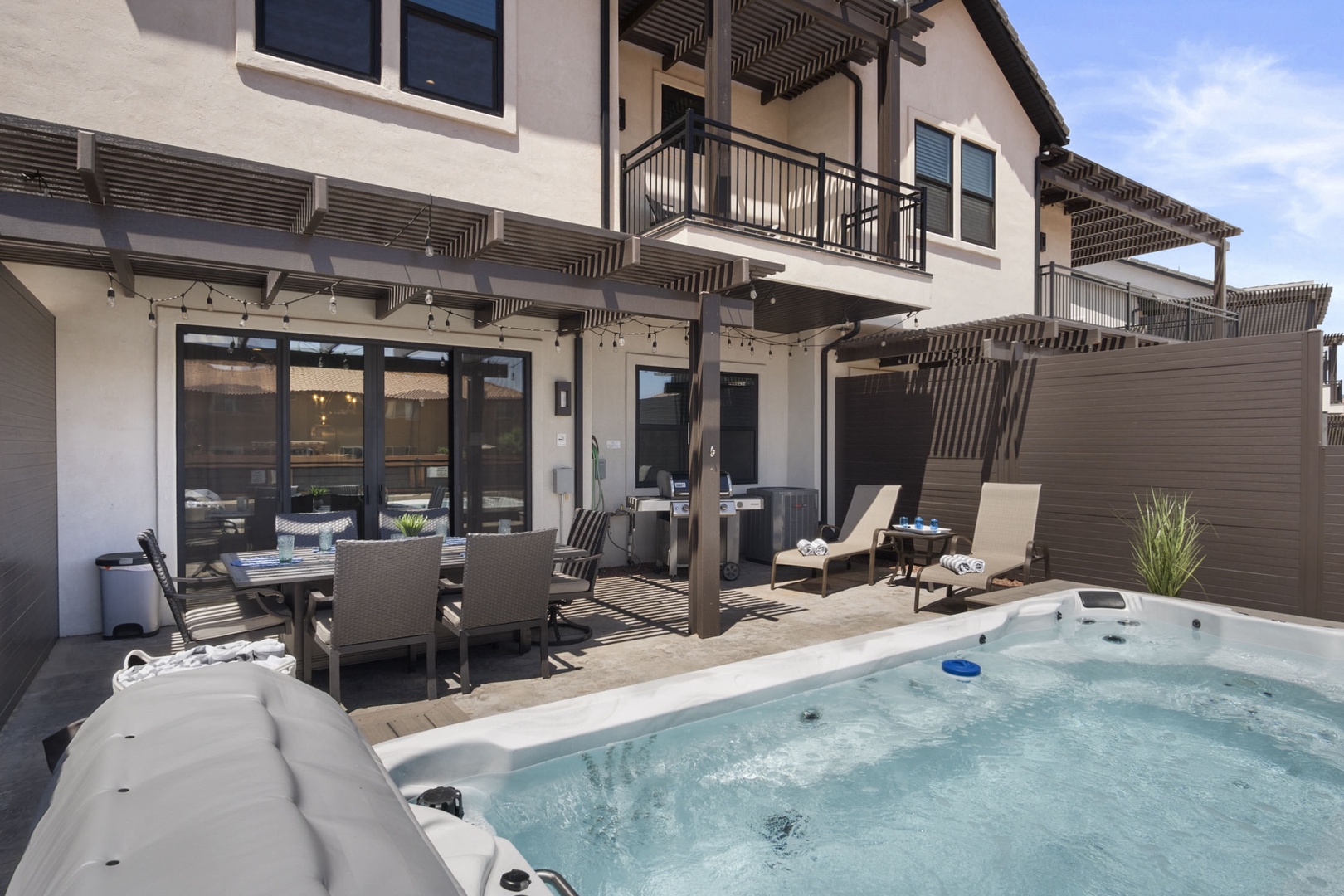Ample outdoor seating by the hot tub
