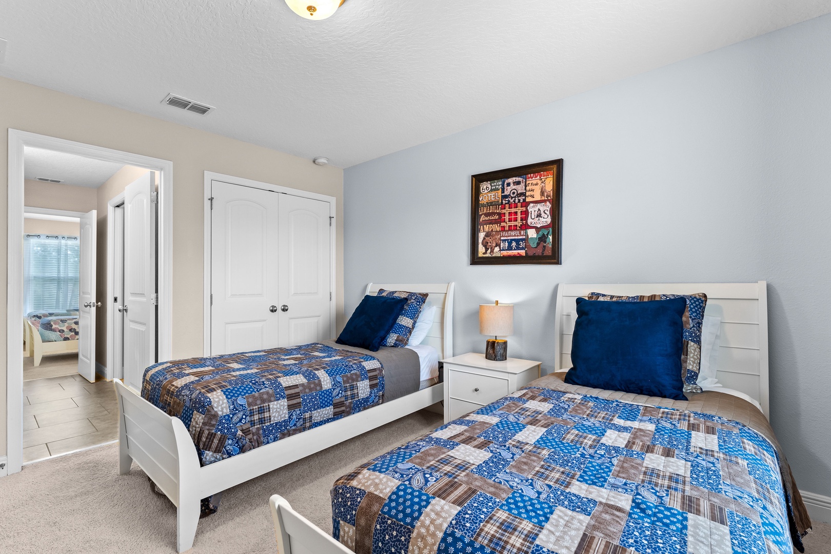 Bedroom 2 with 2 twin beds, Smart TV, and Jack & Jill style ensuite