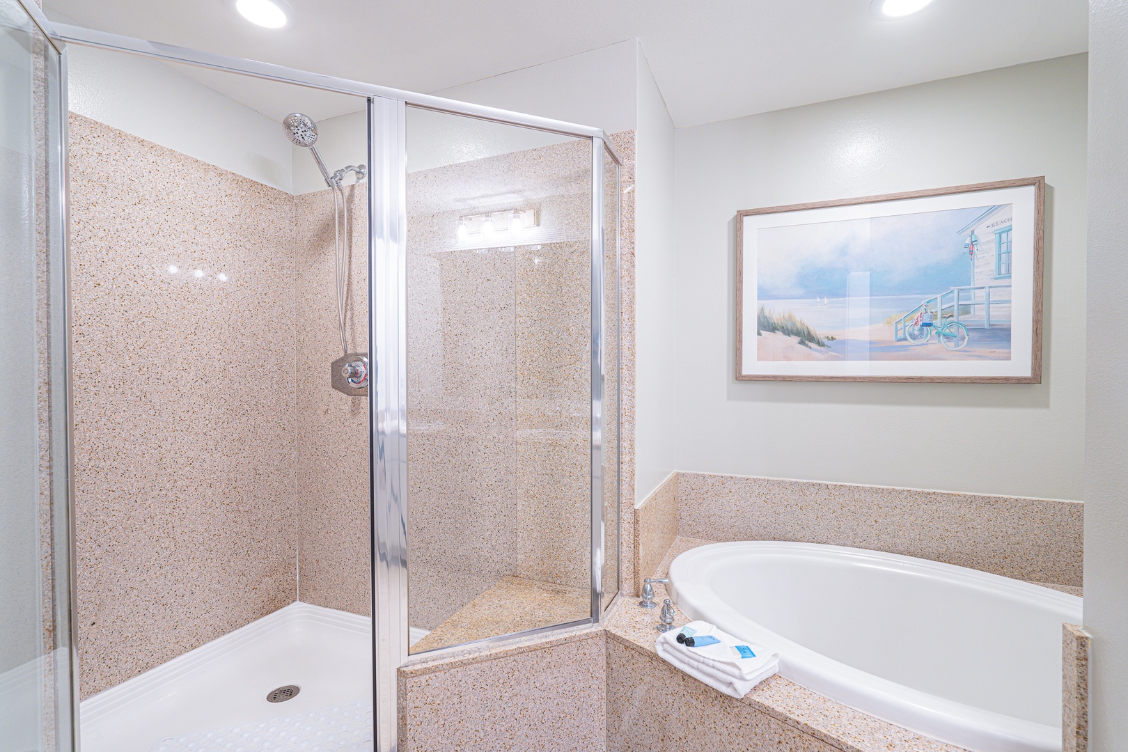 The king ensuite features a dual vanity, glass shower, & soaking tub
