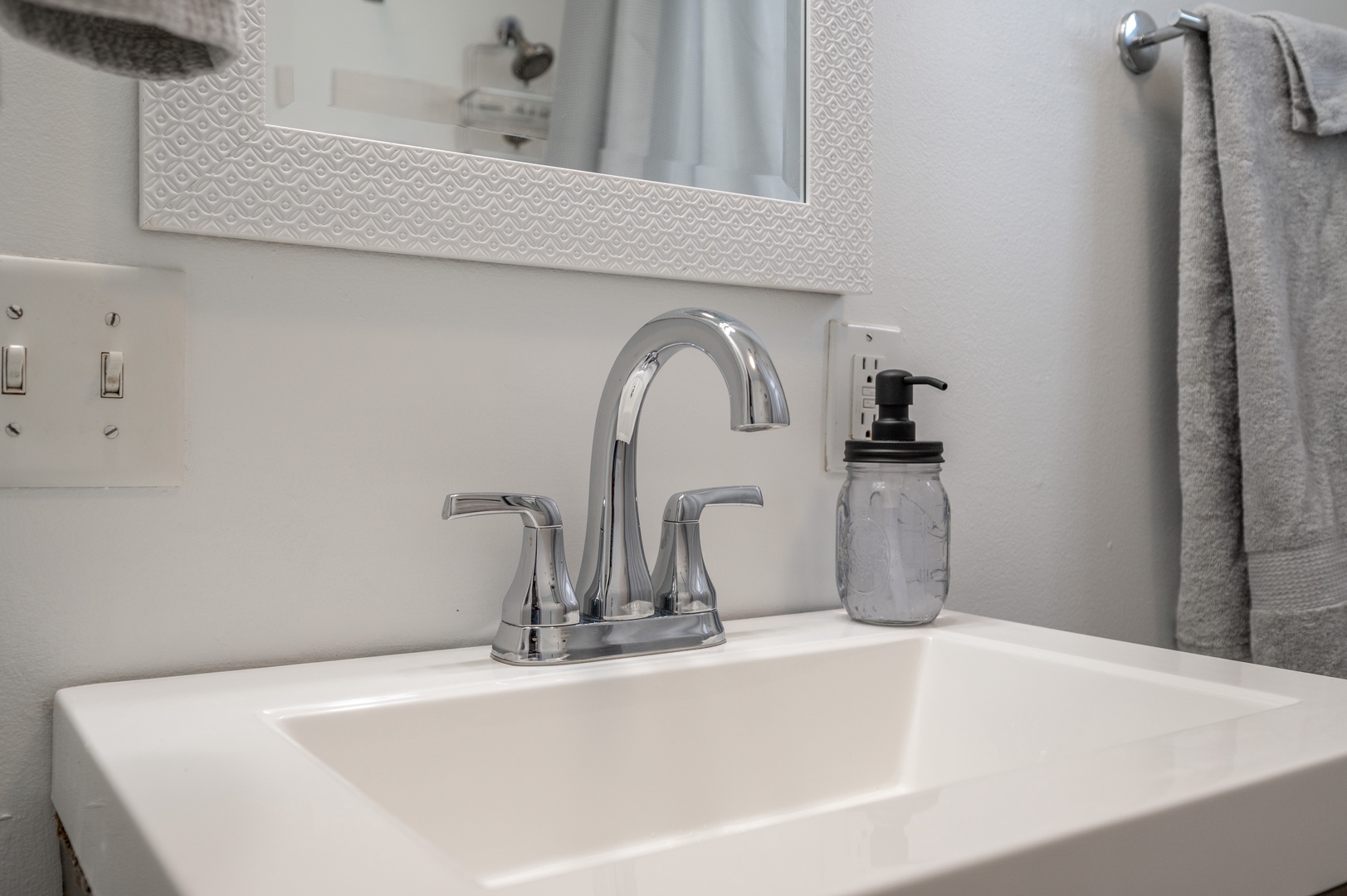 Unit 2 – The main-level full bath offers a single vanity & shower/tub combo