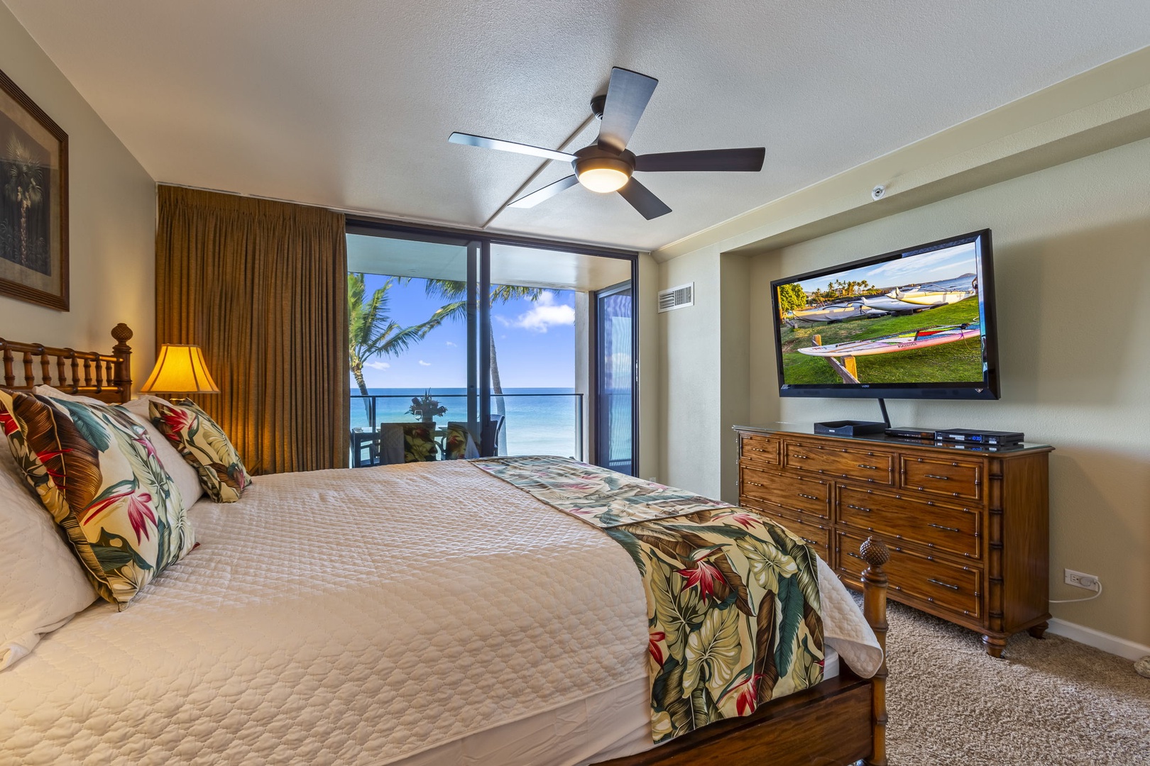 Bedroom with cal-king bed, lanai access, and ensuite