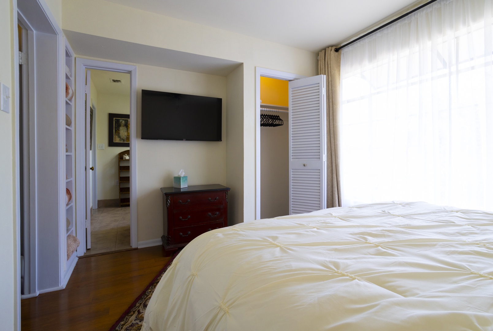 The second bedroom retreat features a plush queen bed & smart TV