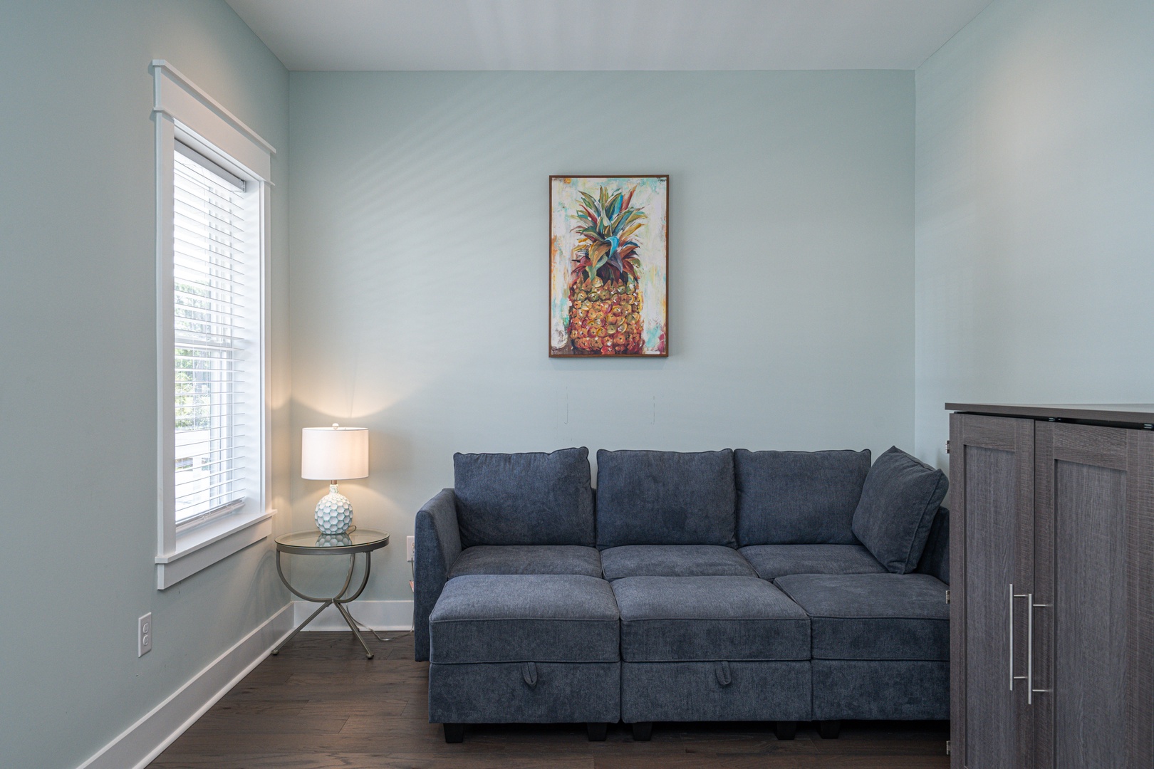 Sun room with queen murphy bed, balcony, seating and TV