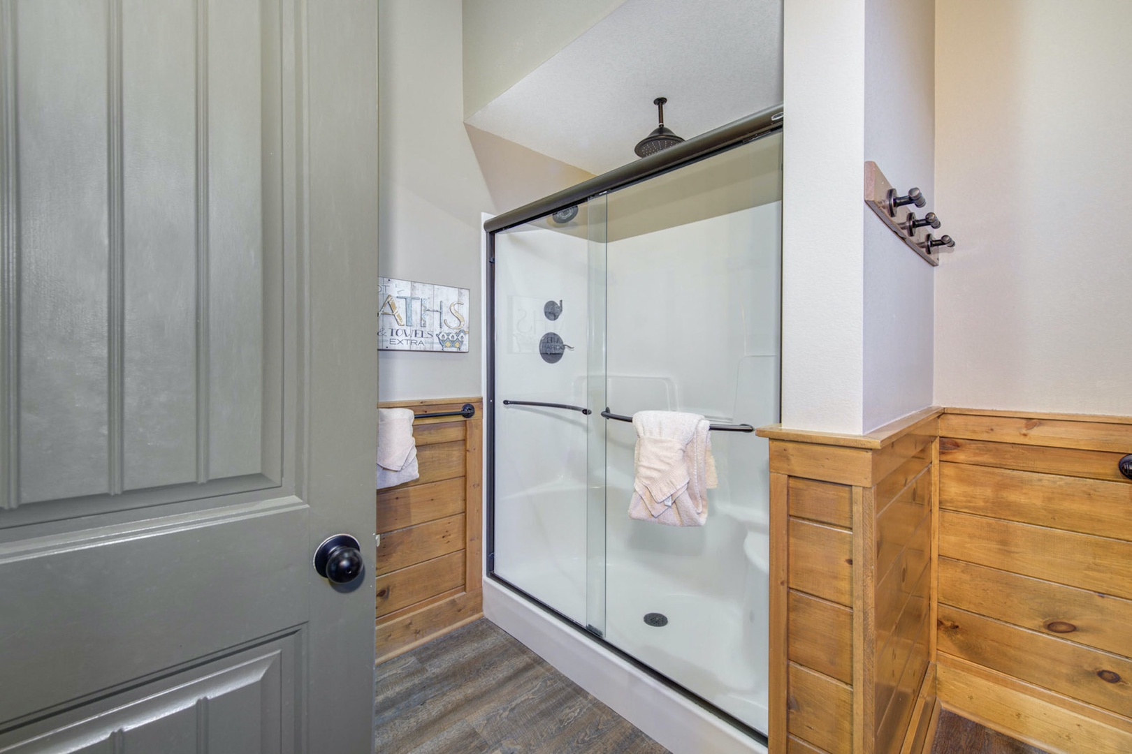 This private ensuite offers an oversized vanity, shower, & soaking tub