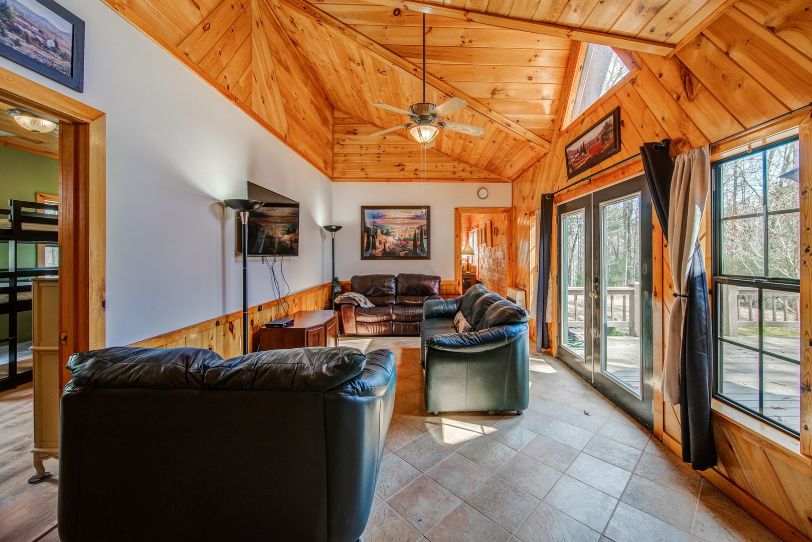 Enjoy plush seating and soaring wood ceilings while kicking back to enjoy a movie in the Living Area