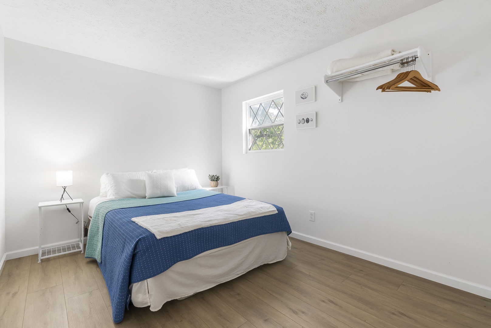 This tranquil 2nd floor bedroom offers a queen-sized bed