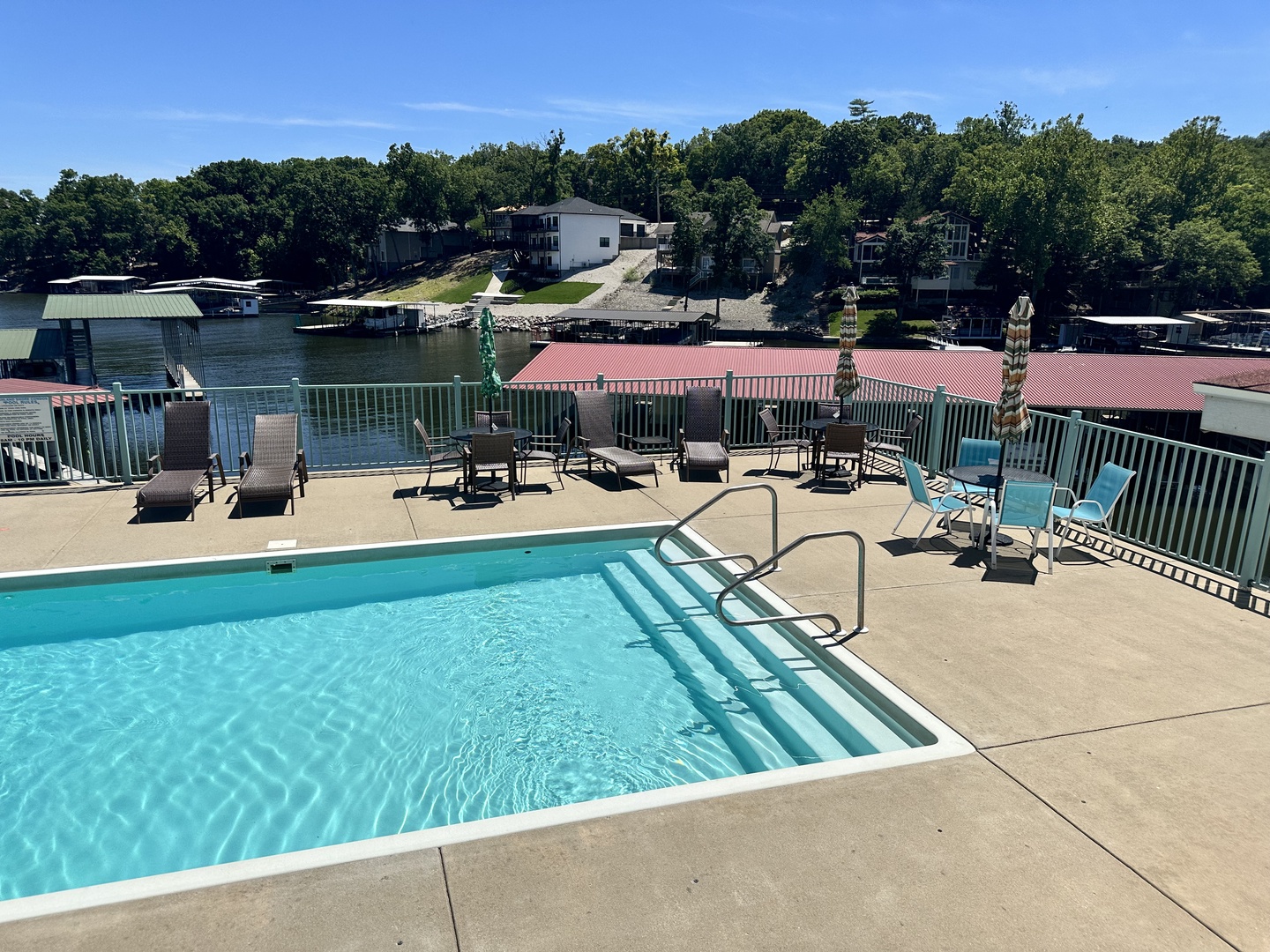 Dive into the pool with a front-row view of the serene lake