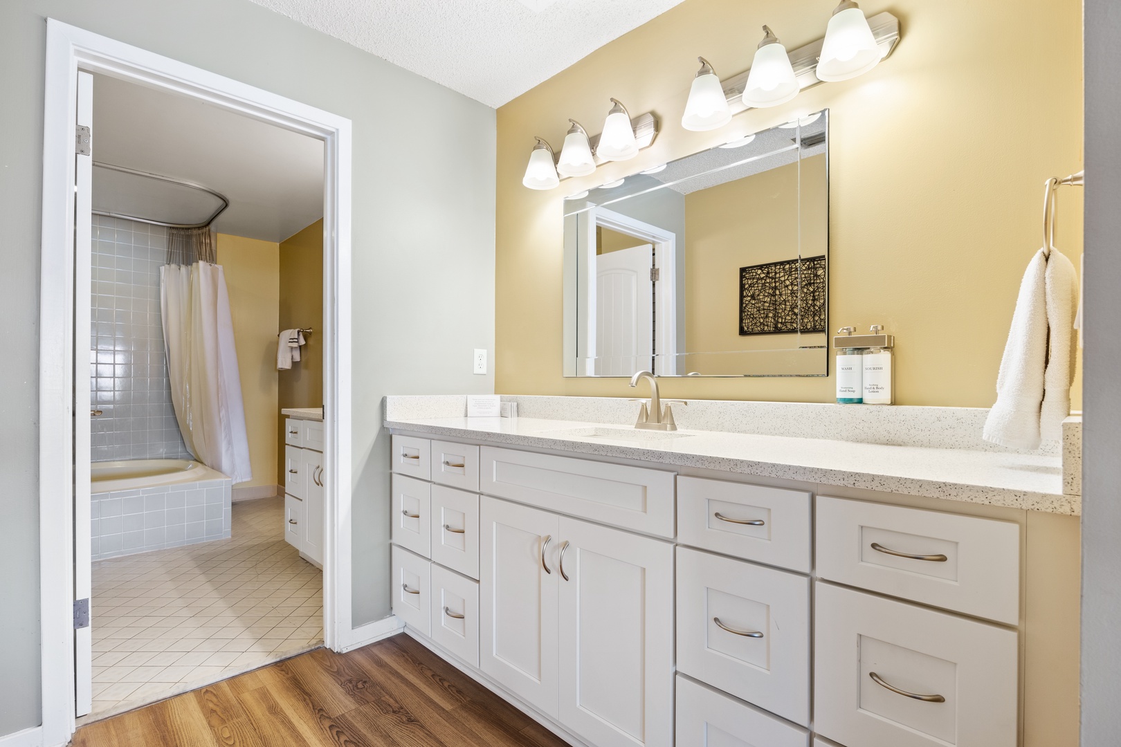 The master en suite offers a pair of large vanities & shower/jetted tub combo