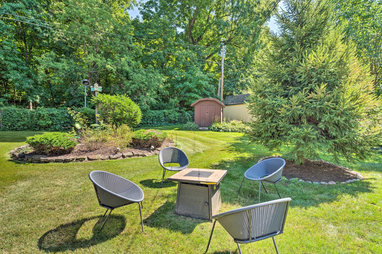 Enjoy the lake breeze in the backyard around the propane fire pit