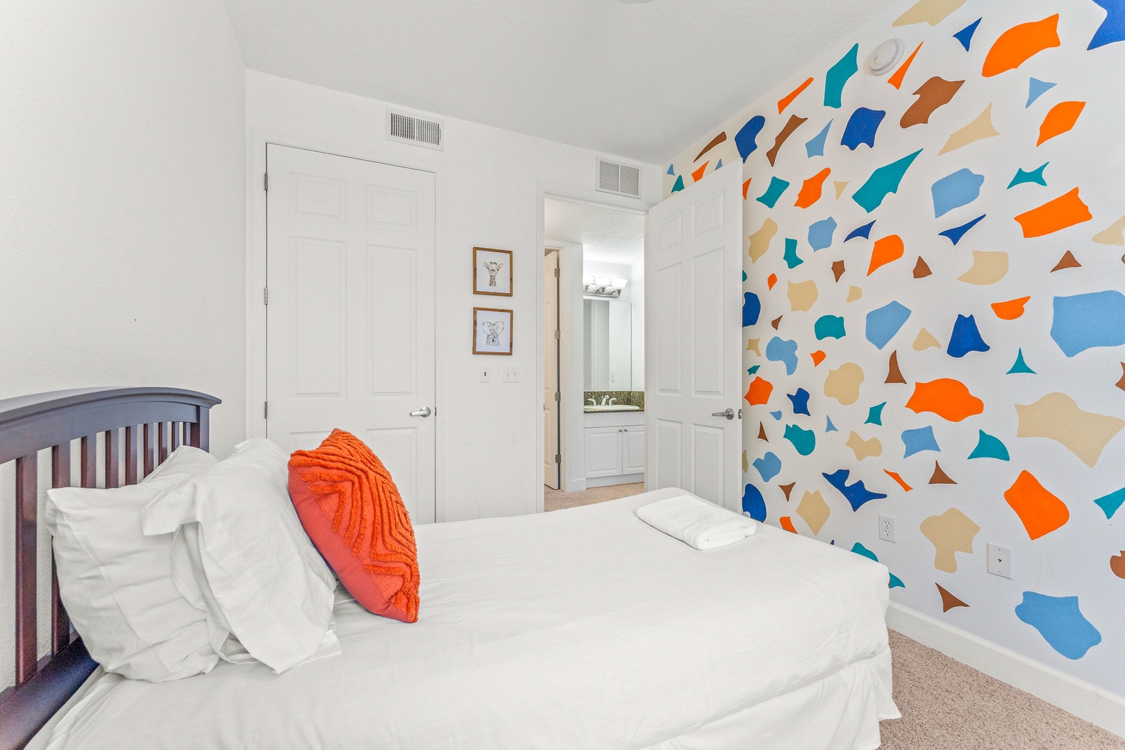 Cheerful double twin bedroom with vibrant, colorful walls
