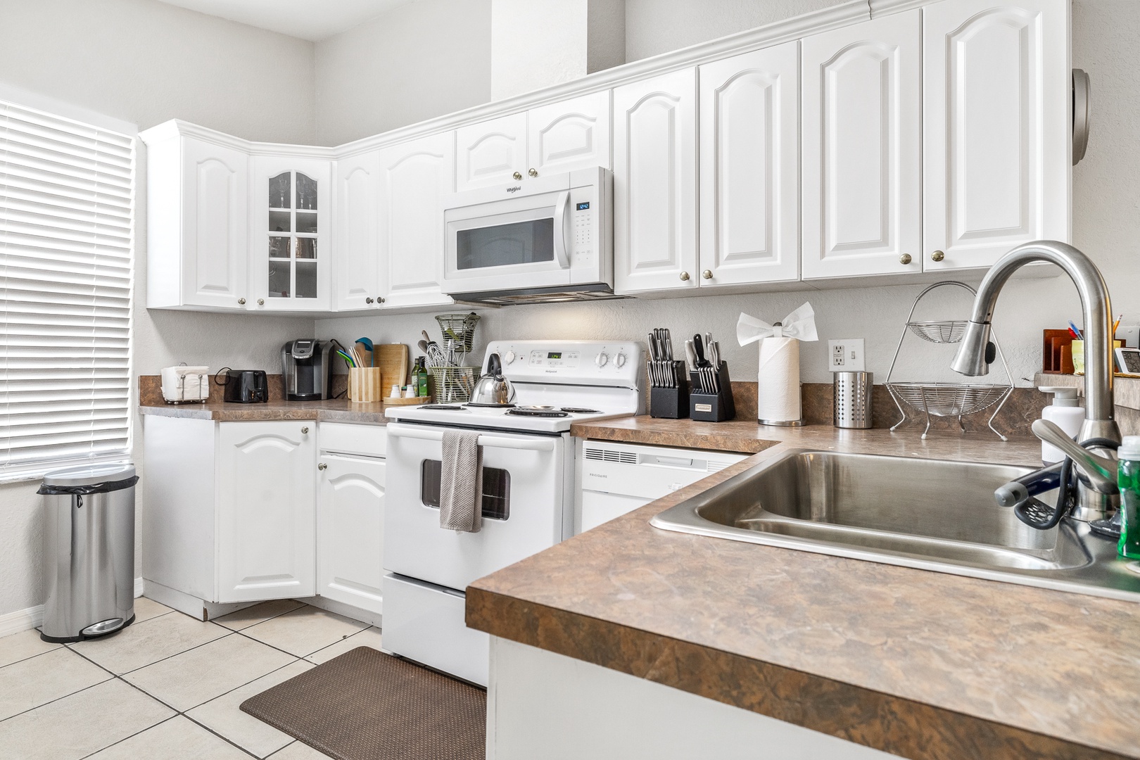 The open, airy kitchen offers ample space & all the comforts of home