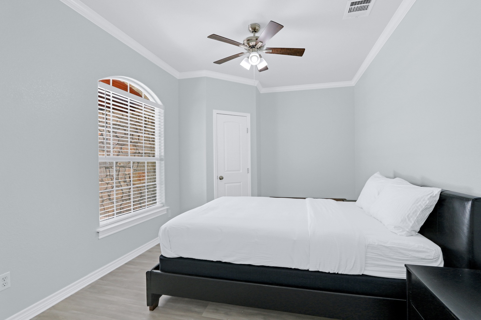 Take in the view in this serene bedroom, which includes a cozy queen bed