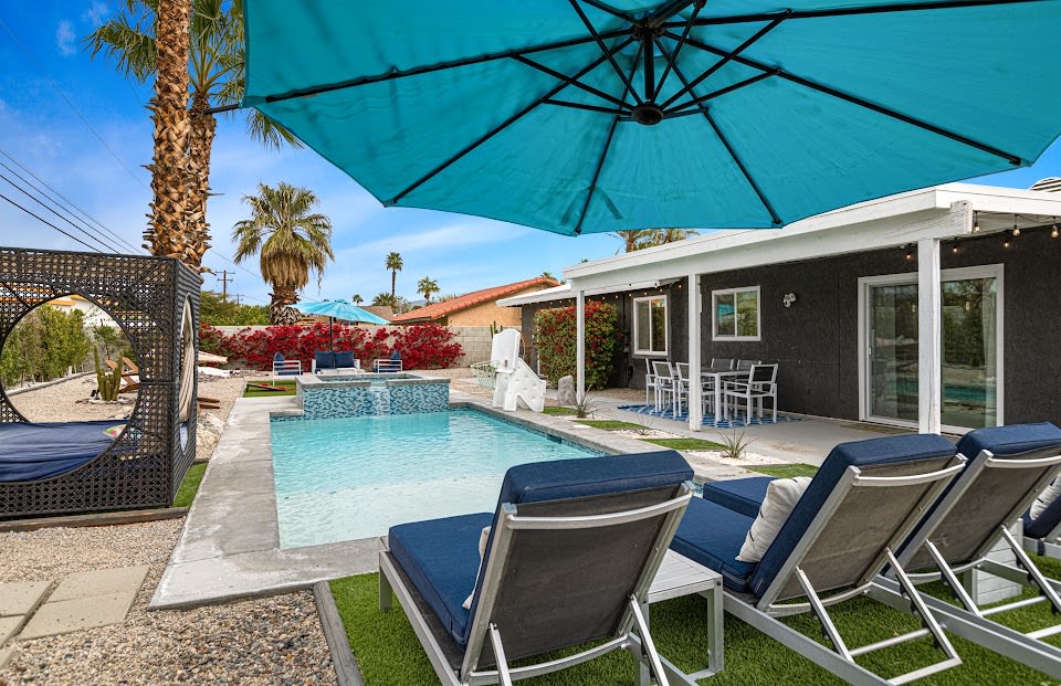 Outdoor dining and lounge chairs by the pool