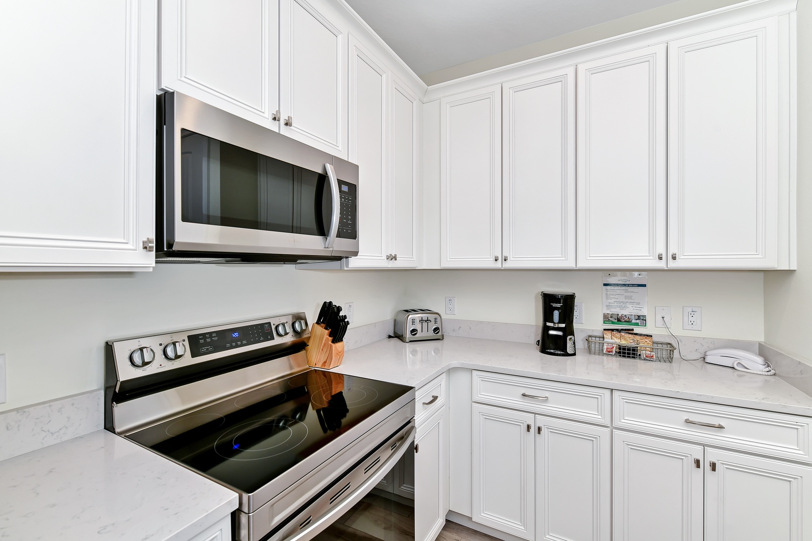 The kitchen offers ample storage space & all the comforts of home