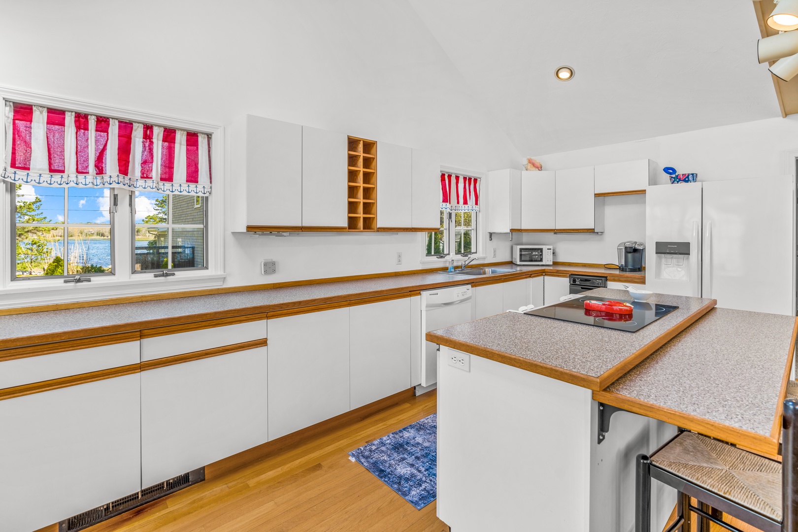 The bright, open kitchen offers ample space & all the comforts of home