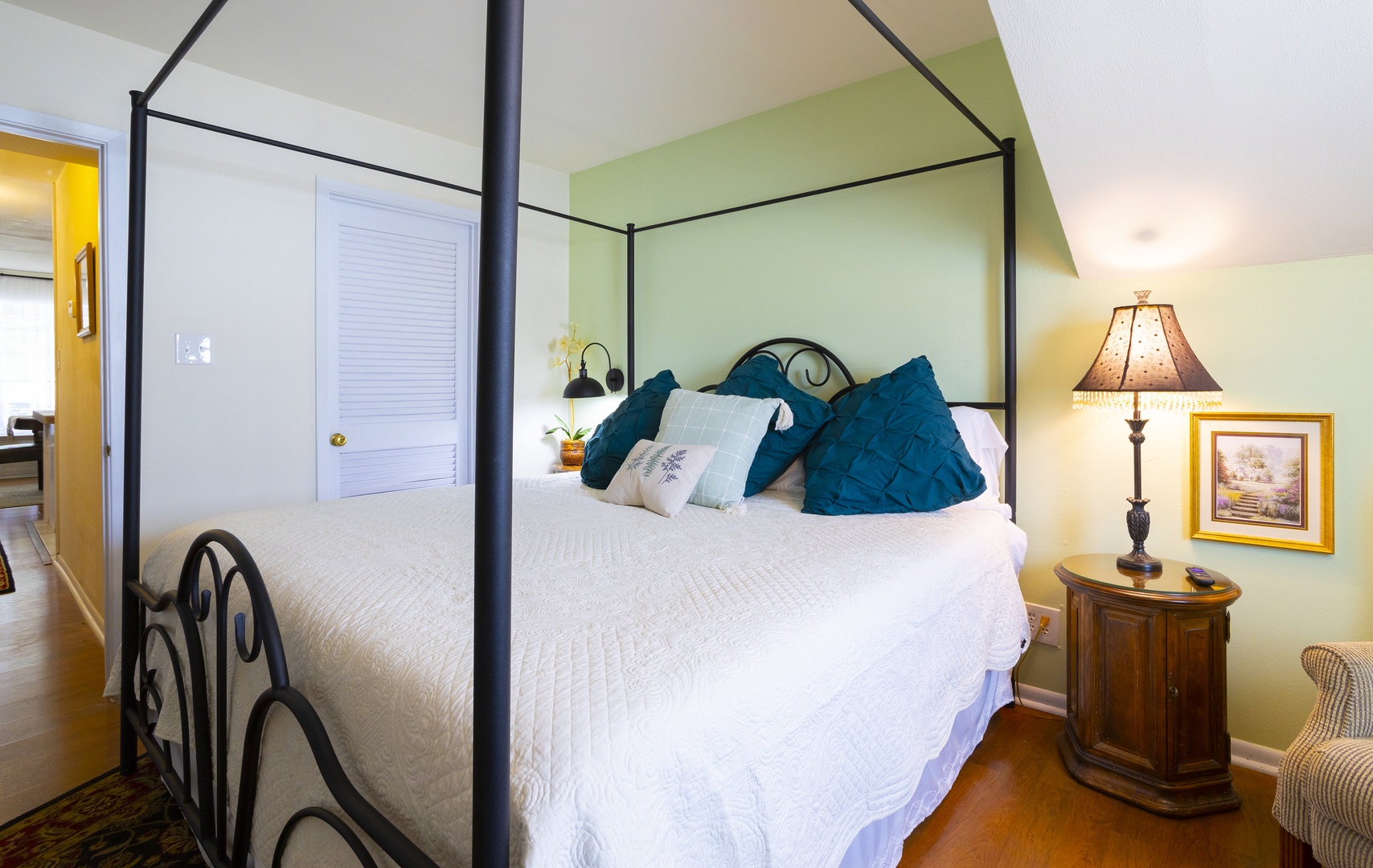 The primary bedroom boasts a regal king bed & smart TV