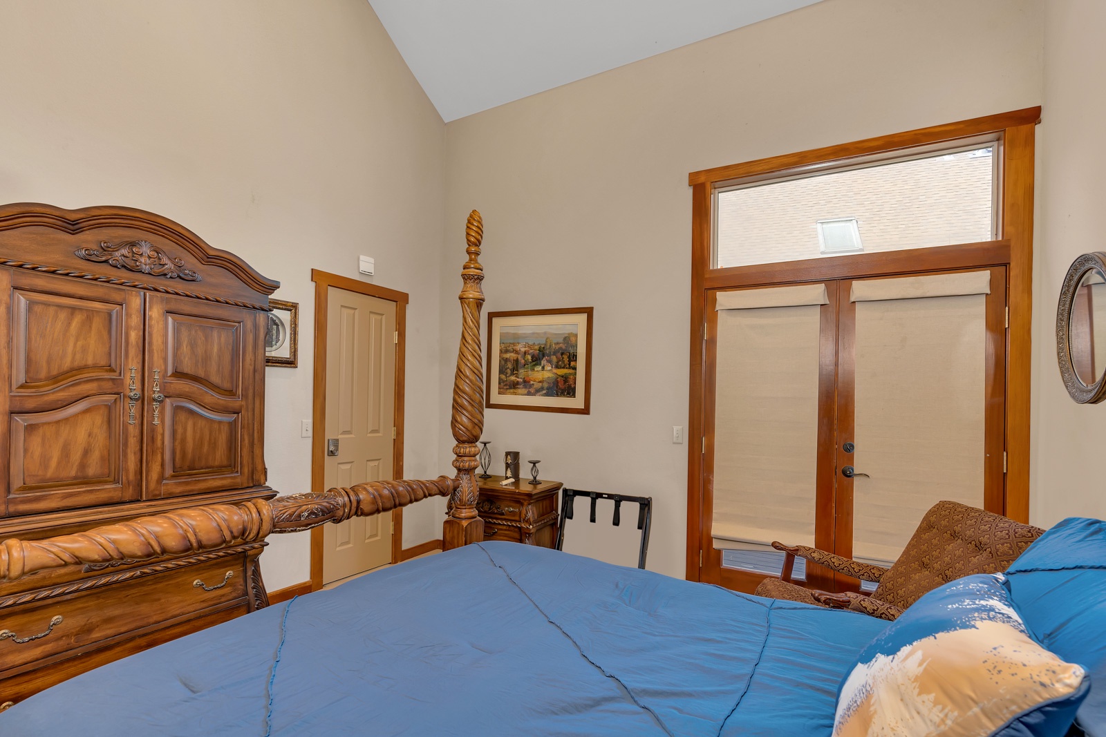 This 1st floor bedroom offers a queen bed, TV, & access to the back deck