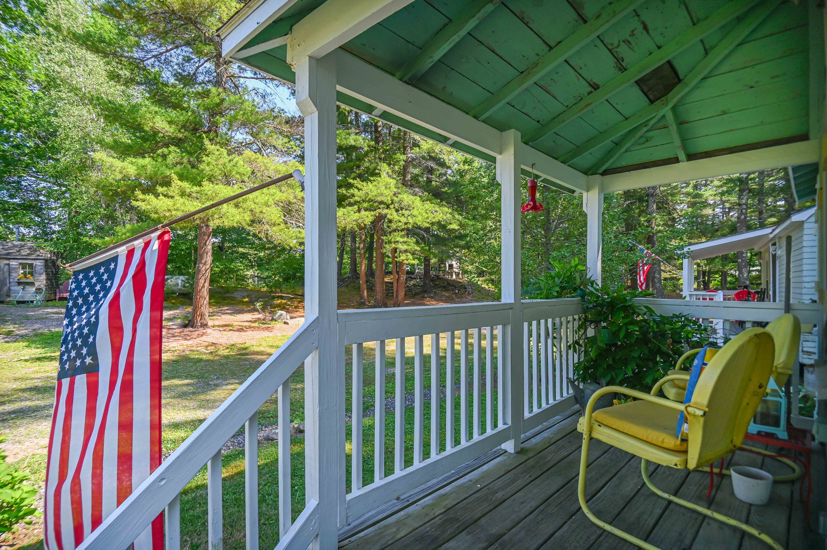 Sip morning coffee or an evening cocktail on the serene front porch